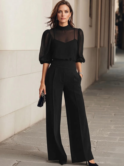 Valentina™ | Conjunto de dos piezas en negro, compuesto por un top sin mangas transparente y unos pantalones de pierna ancha