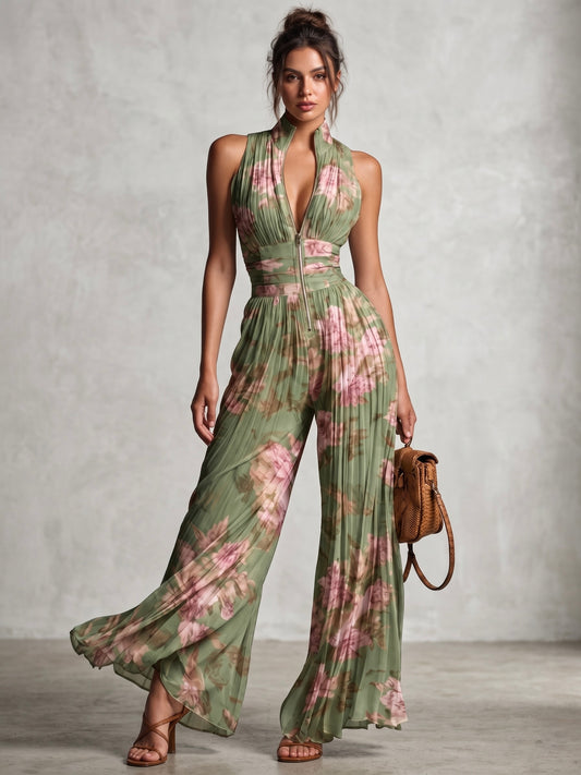 Peto de gasa verde con estampado floral, escote en V, sin mangas, con cremallera y pernera ancha, con pliegues.