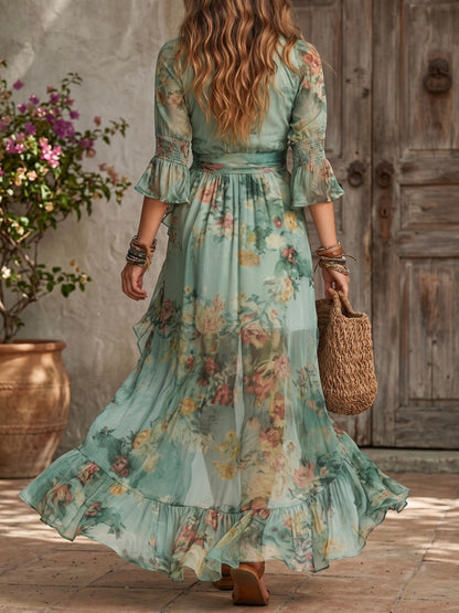 Vestido largo de gasa verde hierba con volantes irregulares y abertura